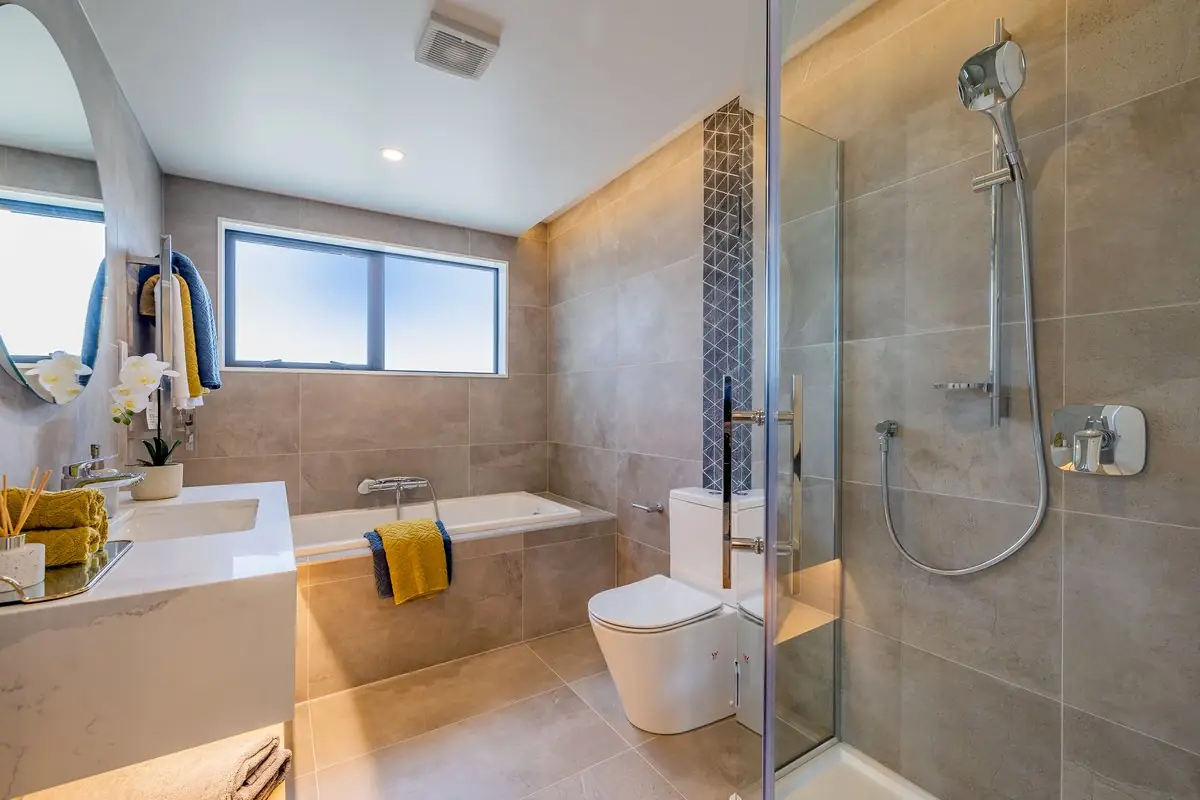 Tiled bathroom with bath and walk-in shower